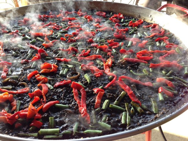 Steaming pan of arroz negro
