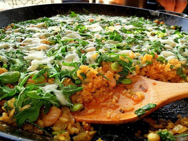 Fresh paella with fava beans