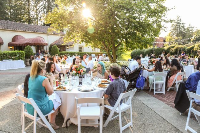 Wedding guests enjoying Spanish food