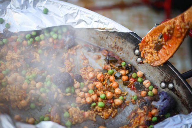 Paella pan and wooden spoon